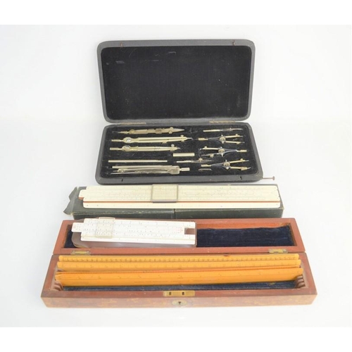 497 - A part-cased set of Lee Guinness technical drawing instruments together with slide rulers, J. Halden... 