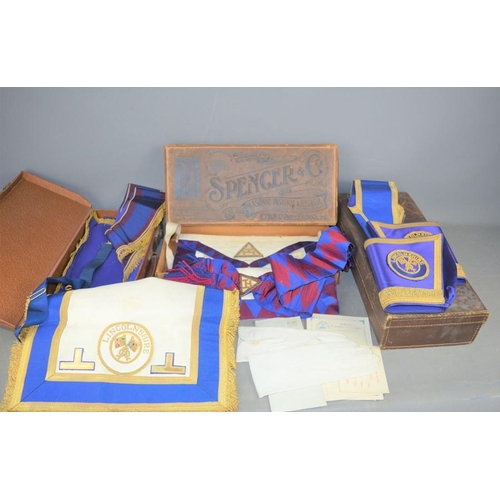 498 - A group of masonic regalia and leather cases to include a sash and apron in its original Spencer & C... 