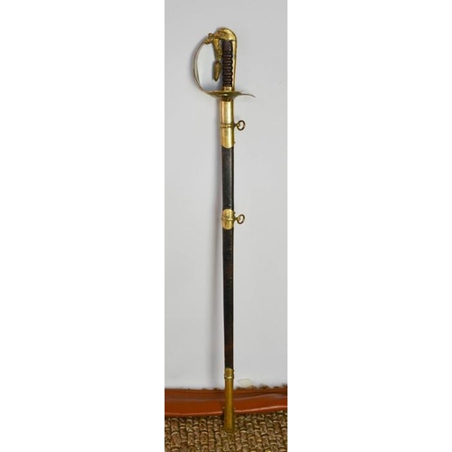 508 - An RAF dress sword with brass hilt, complete with dust sheet, and leather scabbard, with applied RAF... 