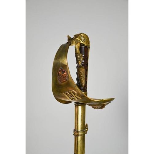 508 - An RAF dress sword with brass hilt, complete with dust sheet, and leather scabbard, with applied RAF... 