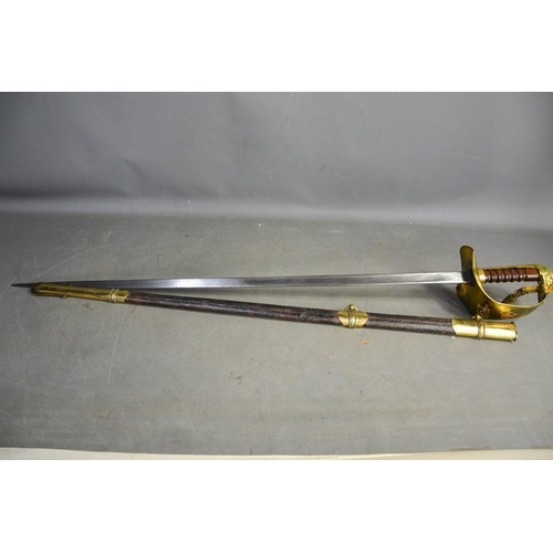 508 - An RAF dress sword with brass hilt, complete with dust sheet, and leather scabbard, with applied RAF... 