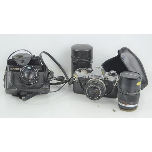 513 - A Yashica Electro 35 gx 35mm camera together with an Olympus OM10 camera and lens