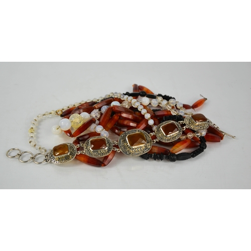 166 - A silver and agate set bracelet, and three beaded necklaces.