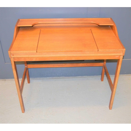 145 - A mid-century teak dressing table with lift up mirror