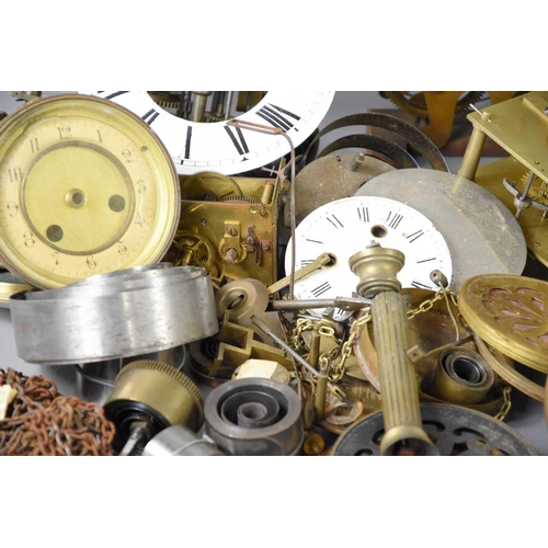 107 - A large group of clock parts to include dials, fusee movement, chapter ring, spring and other items.