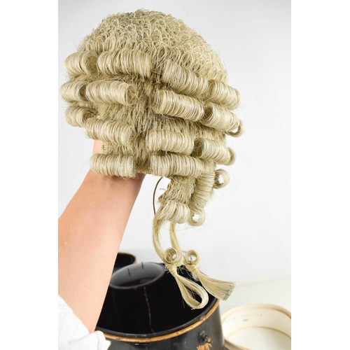 142 - An antique barristers wig and original display tin, by Ravenscroft Law, Wig & Robe Makers, Lincolns ... 