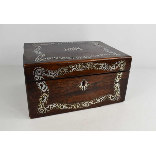 151 - A 19th century rosewood and mother of pearl vanity case, the blue velvet lined and fitted interior h... 