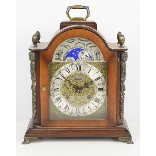 17 - A Franz Hermie mahogany cased mantle clock, manual wind movement, moon phase, raised on bracket feet... 