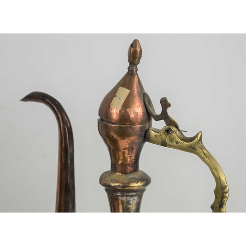 200 - A group of 19th century and later Middle Eastern copper and brass ewers together with a water storag... 