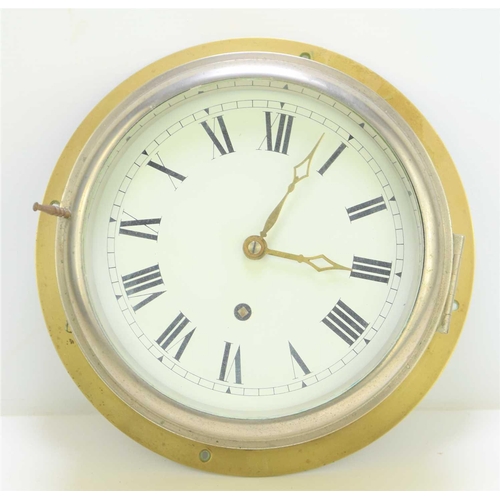 21 - An early 20th century Air Ministry marked brass bulkhead clock, white dial with Roman numeral chapte... 