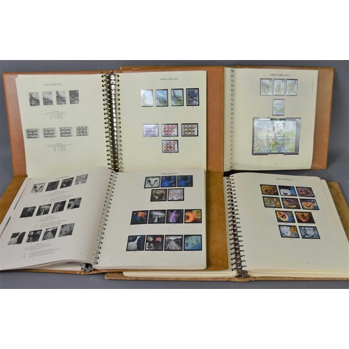 393 - Four Stanley Gibbon albums of 1971-2003 mint stamps to include prestige and greeting booklet panes, ... 