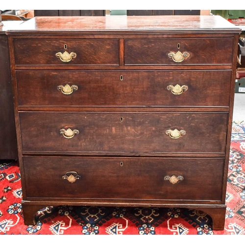 498 - A 19th century oak chest of drawers, with two short over three long graduated drawers, raised on bra... 