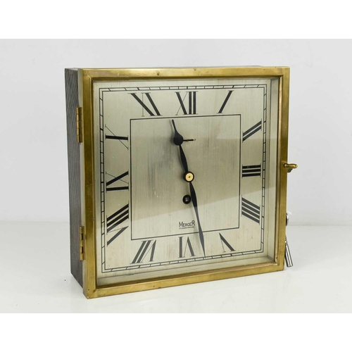 54 - An Art Deco period Mercer wall clock, of square form, the wooden case with brass glazed door enclosi... 