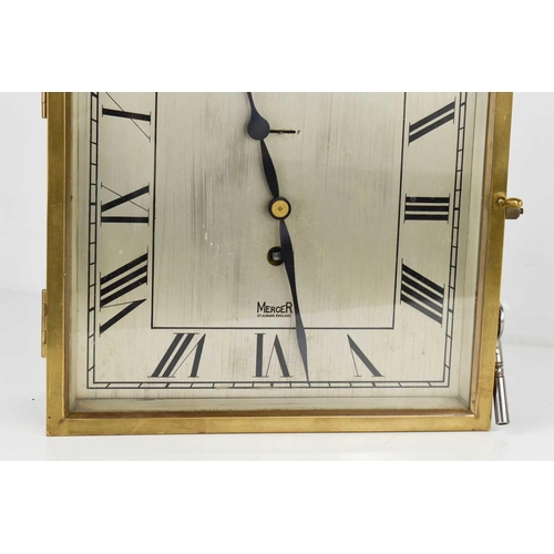 54 - An Art Deco period Mercer wall clock, of square form, the wooden case with brass glazed door enclosi... 