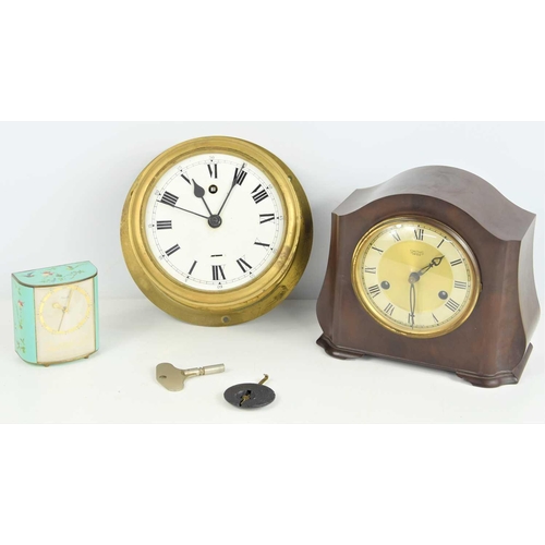 57 - A brass circular bulkhead clock, a Bakelite Smiths clock and a small painted Kienzle clock.