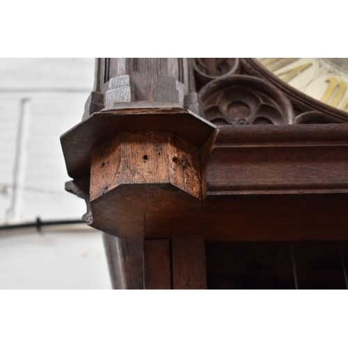 72 - An impressive Gothic revival Victorian clock, the silvered circular dial having gilt brass Gothic Ro... 