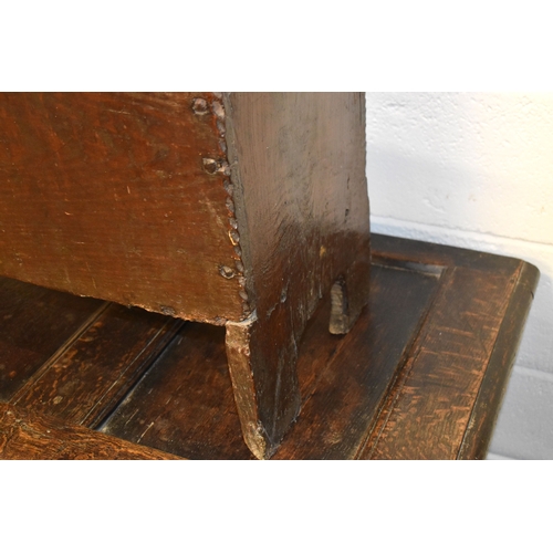 494 - A 17th century boarded oak coffer, with V cut end boards, chip carved corners, candlebox interior, a... 