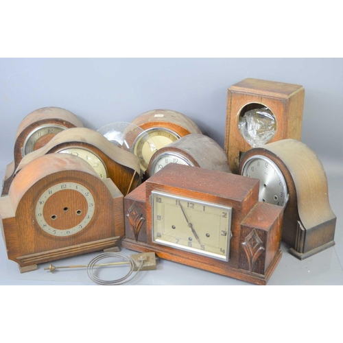 101 - A group of eight oak cased mantle clocks to include examples by Smiths, a/f.