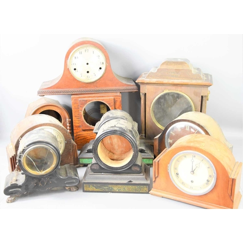 106 - A group of oak cased mantle clocks to include Smiths examples together with various mantel and brack... 