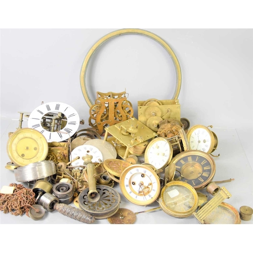 107 - A large group of clock parts to include dials, fusee movement, chapter ring, spring and other items.