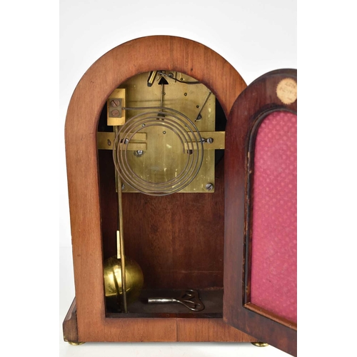 12 - An Edwardian mahogany domed mantle clock, inlaid with boxwood stringing, the convex glass door enclo... 