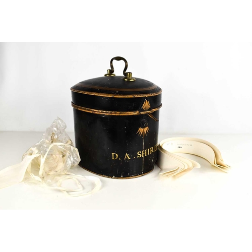 142 - An antique barristers wig and original display tin, by Ravenscroft Law, Wig & Robe Makers, Lincolns ... 