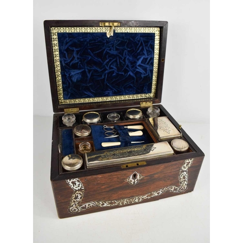 151 - A 19th century rosewood and mother of pearl vanity case, the blue velvet lined and fitted interior h... 