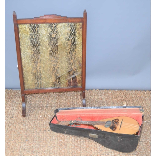 160 - An Italian mandolin together with a snakeskin firescreen.