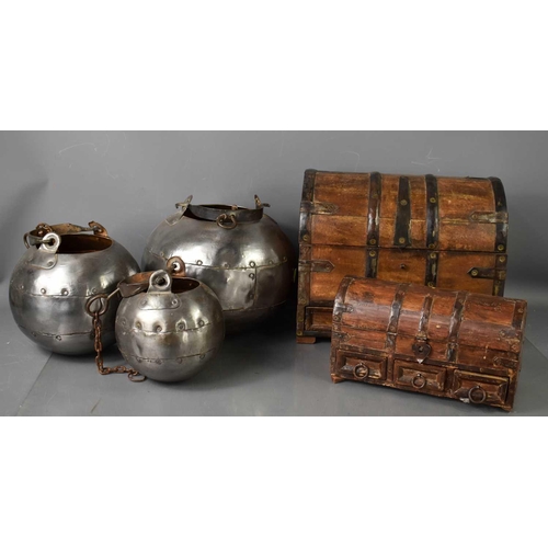 175 - Two medieval style domed iron clad caskets, together with three steel medieval style jars with iron ... 