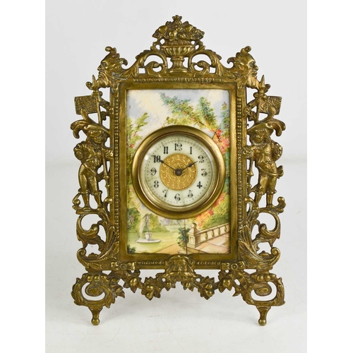 18 - A French brass and porcelain table clock, the Arabic dial set within a porcelain plaque painted with... 