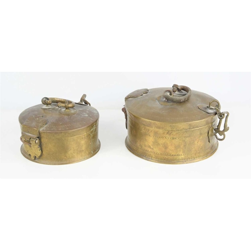 191 - Two brass Indian chapati storage boxes, hand engraved geometric motifs to the top, the largest measu... 