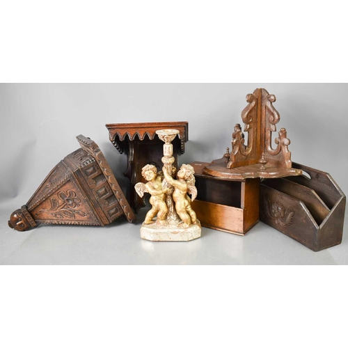 197 - Three treen carved wall brackets, one terminating with a face mask, together with a letter rack, can... 