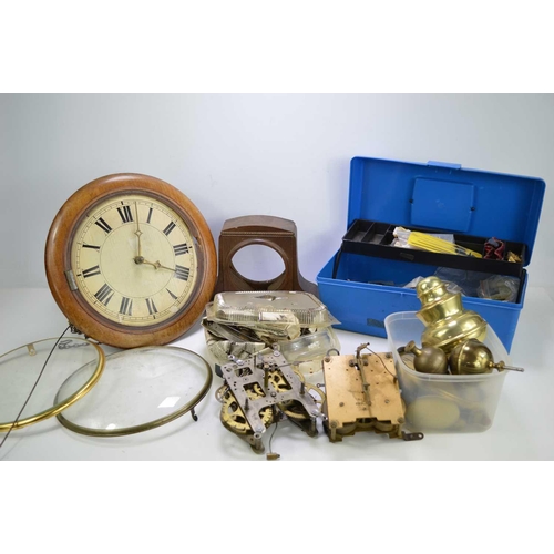 202 - A group of clock spares and some tools to include, a hook and spike wall clock, movements, dials and... 