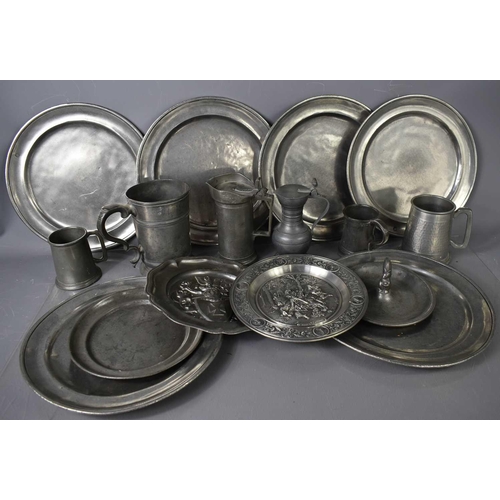 214 - A selection of pewter chargers, tankards, plates, jug and a trinket dish centred with a squirrel.