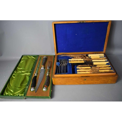 217 - An oak cased canteen of cutlery together with a vintage carving set in the original presentation box... 