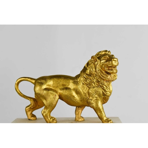 23 - A French alabaster and gilt metal mantle clock, surmounted by a lion, the green/blue Arabic dial bor... 