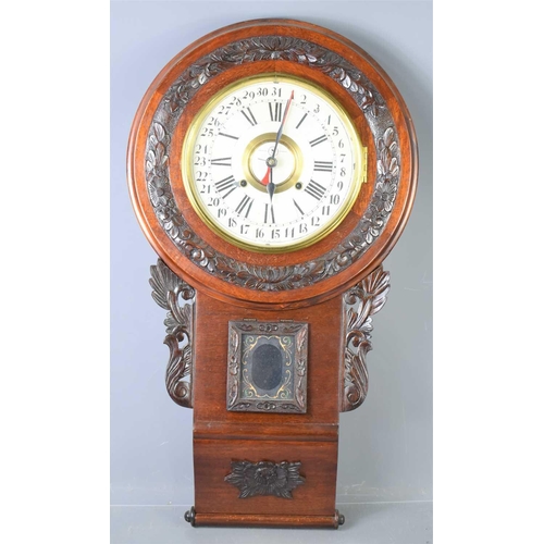 24 - An early 20th century mahogany cased Seikosha regulator calendar wall clock, the case with carved fo... 