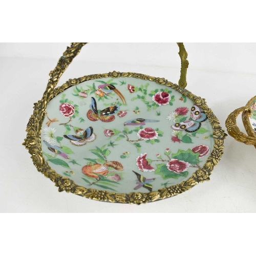 274 - A Chinese canton dish in a brass basket form frame, together with a famille rose dish in metal frame... 