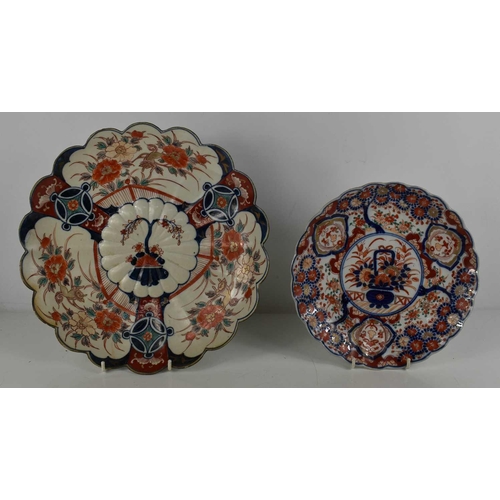 275 - A 19th century Imari dish, with scalloped edge, and flowering plant painted to the centre, together ... 