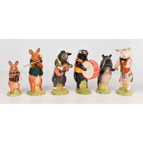 301 - A group of Beswick pottery musical pigs, including guitarist, drummer, flautist and others. (6)