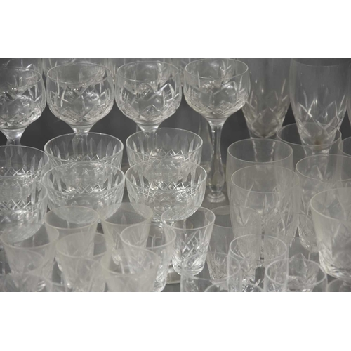 307 - A large group of mainly Stuart crystal drinking glasses of various sizes and styles.