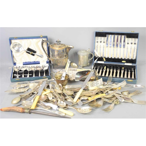 316 - A group of silver plated items to include a boxed set of Mappin and Webb cake knives and forks, flat... 