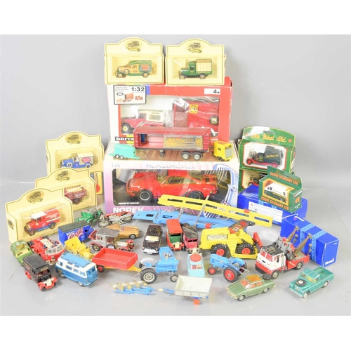 324 - A large group of Dinky, Corgi, Lledo and other diecast models to include some boxed examples.