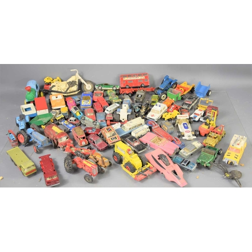 345 - A large group of Dinky, Corgi, Lesney and other diecast and plastic cars and vehicles.