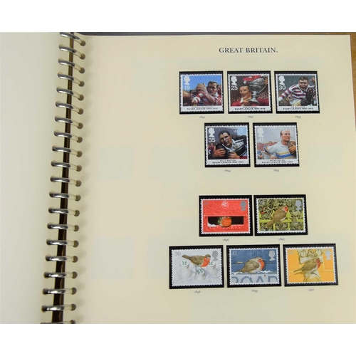 393 - Four Stanley Gibbon albums of 1971-2003 mint stamps to include prestige and greeting booklet panes, ... 