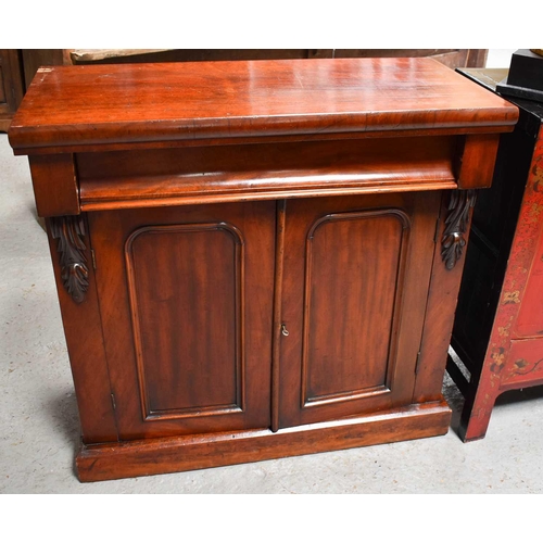 454 - A Victorian mahogany sideboard, with frieze drawer above two panelled doors, 85cm high by 89cm wide ... 