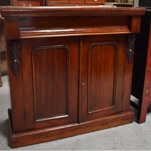 454 - A Victorian mahogany sideboard, with frieze drawer above two panelled doors, 85cm high by 89cm wide ... 