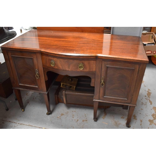 456 - An early 20th century sideboard, with bow front drawer flanked by cupboards, raised on square tapere... 