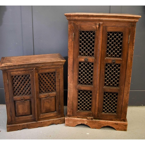 460 - Two hardwood food cabinets, possibly Indonesian, with lattice work panels, enclosing interior shelve... 