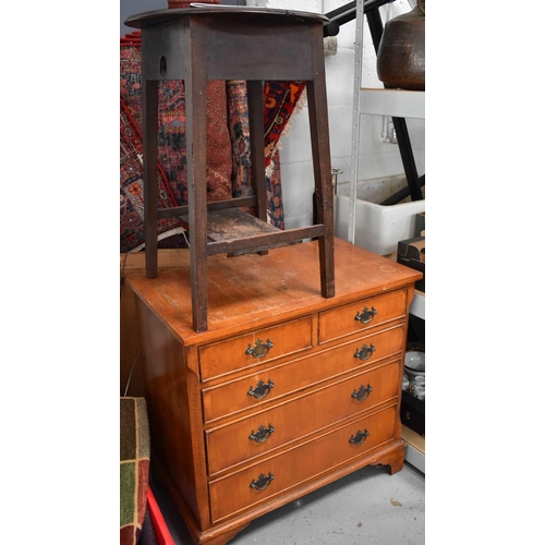 466 - A 1940s cricket table together with a small reproduction chest of drawers raised on bracket feet.